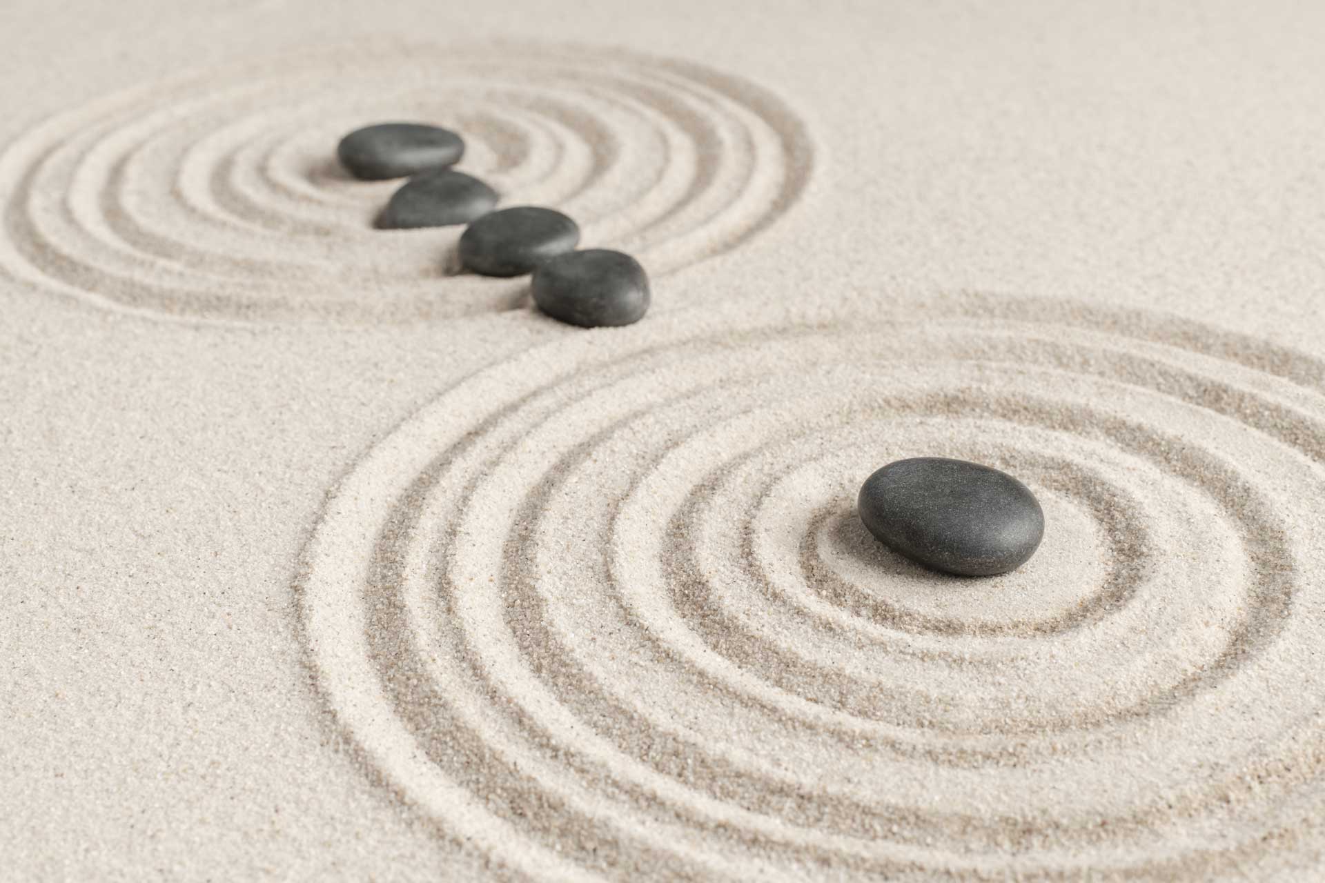 zen stones sand background health and wellness